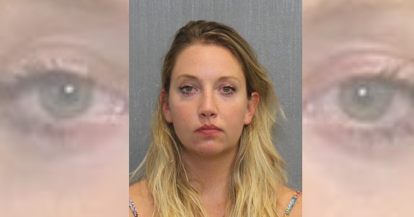 Woman intoxicated from Hooters charged while waiting for boyfriend at stop sign
